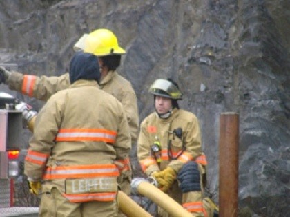 Firemen Discussing ISO Testing